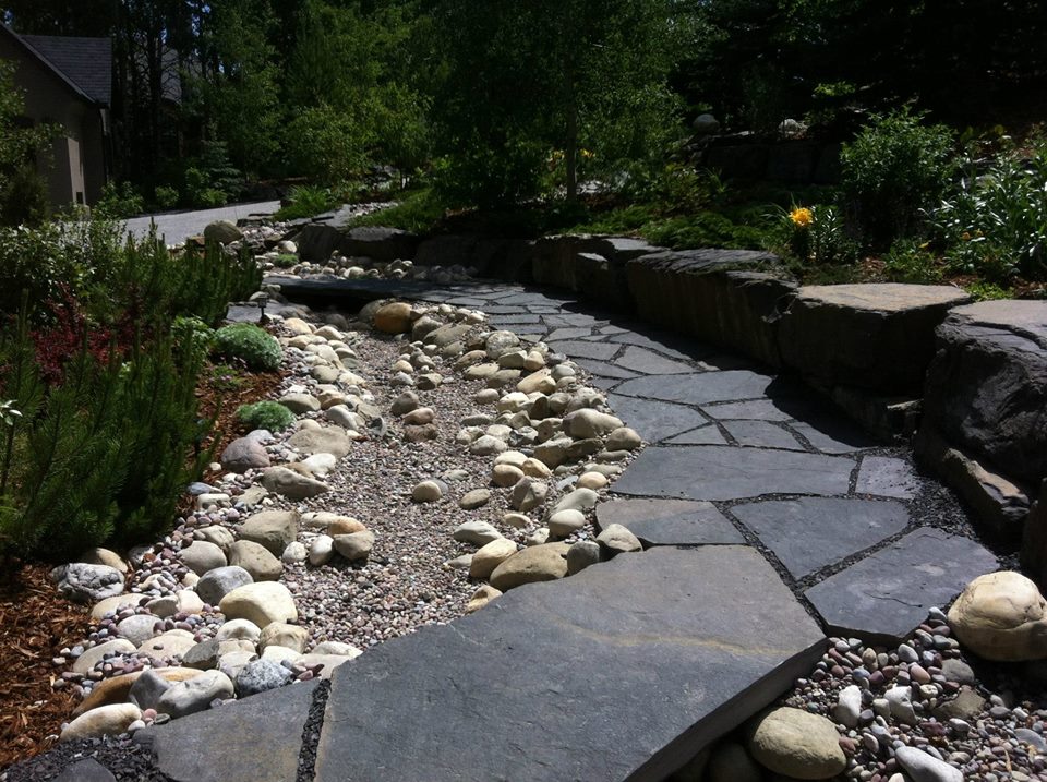 CityScape Landscaping Calgary - Dry river bed with stone bridge / pathway rundle