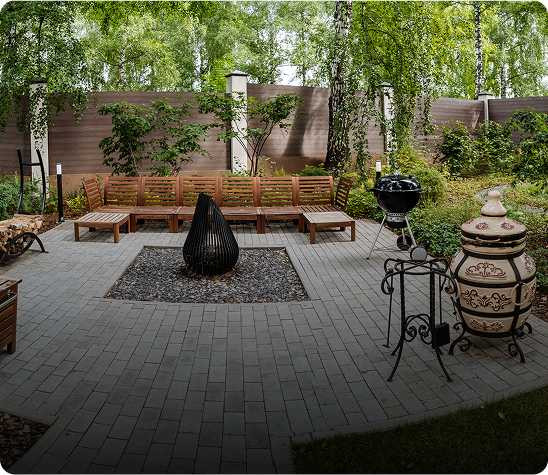 Cozy backyard patio with wooden seating area.